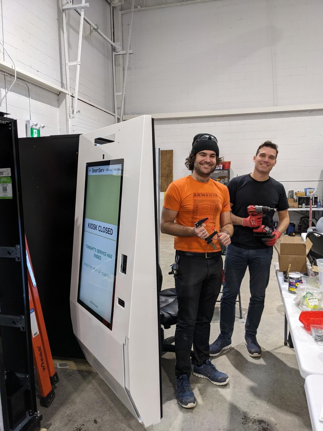Behind the scenes, assembling the SmartServ machines.